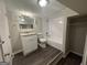 Bathroom with updated vanity, vinyl floors and shower-tub combo at 4329 Parkview Dr, Lithia Springs, GA 30122