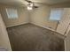 Bright bedroom features neutral carpet, two windows and ceiling fan at 4329 Parkview Dr, Lithia Springs, GA 30122
