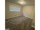 Neutral bedroom with carpet, large window, and a closet at 4329 Parkview Dr, Lithia Springs, GA 30122