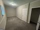 This bedroom has neutral walls, a standard ceiling light and carpeted floors at 4329 Parkview Dr, Lithia Springs, GA 30122