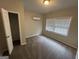 Spacious bedroom with carpet, bright window, and a closet at 4329 Parkview Dr, Lithia Springs, GA 30122