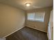 Neutral bedroom with carpet floors, bright window, and closet at 4329 Parkview Dr, Lithia Springs, GA 30122