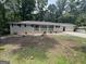Ranch home with painted brick exterior, covered porch, and level front yard at 4329 Parkview Dr, Lithia Springs, GA 30122