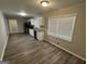 Modern kitchen with white cabinets, stainless steel appliances, and granite countertops at 4329 Parkview Dr, Lithia Springs, GA 30122