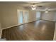 Spacious living room featuring wood-look flooring and french doors to backyard at 4329 Parkview Dr, Lithia Springs, GA 30122