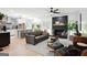 Open-concept living area featuring a fireplace, comfortable sofa, and seamless flow to the kitchen at 109 Old Virginia Cir, Jonesboro, GA 30236