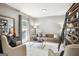 A bright living room featuring neutral tones, modern furniture, and a decorative ladder shelf at 109 Old Virginia Cir, Jonesboro, GA 30236