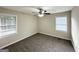 Cozy bedroom with two windows and neutral carpet creating a bright and comfortable space at 70 Macon Se Pl, Atlanta, GA 30354