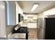 Modern kitchen with stainless steel appliances, granite countertops, and stylish white cabinetry at 70 Macon Se Pl, Atlanta, GA 30354