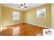 Comfortable bedroom featuring hardwood floors and ample natural light from two windows at 2101 Newgate, Decatur, GA 30035
