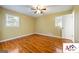 Cozy bedroom with hardwood floors and two windows for natural light at 2101 Newgate, Decatur, GA 30035