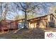 The house's exterior with the garage, deck, and backyard are highlighted with mature trees at 2101 Newgate, Decatur, GA 30035
