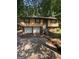 Inviting exterior of a split level home featuring an attached two car garage and mature trees at 2101 Newgate, Decatur, GA 30035
