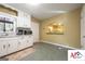 Kitchen featuring white cabinets, marble countertops, and a view into the adjacent dining room at 2101 Newgate, Decatur, GA 30035