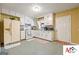 Cozy kitchen includes white appliances and cabinets offering ample space for cooking and storage at 2101 Newgate, Decatur, GA 30035
