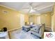 Open-plan living area has ample seating with natural light, ceiling fan and hardwood flooring at 2101 Newgate, Decatur, GA 30035