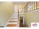 Inviting staircase with wood and iron railing leading to upper and lower levels at 2101 Newgate, Decatur, GA 30035