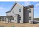 Backyard with gray siding, covered patio, green space, and a grassy yard at 469 Ralph Still, Dacula, GA 30019