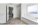 Primary bathroom with a soaking tub and a separate shower area at 469 Ralph Still, Dacula, GA 30019