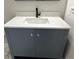 Stylish bathroom vanity with a white countertop, undermount sink, and sleek gray cabinetry at 7562 Asbury Manor, Lithonia, GA 30058