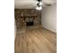 The living room features a stone fireplace, laminate flooring, and fresh paint at 7562 Asbury Manor, Lithonia, GA 30058