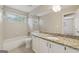 Bathroom features a granite countertop, white cabinets, and tub shower combo at 686 Shore Ln, Lithonia, GA 30058