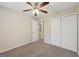 Bedroom features neutral walls, carpet and ceiling fan with lighting at 686 Shore Ln, Lithonia, GA 30058
