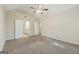 Large bedroom with vaulted ceiling, carpet flooring and access to en-suite bathroom at 686 Shore Ln, Lithonia, GA 30058
