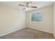 Bedroom features neutral walls, carpet and ceiling fan with lighting at 686 Shore Ln, Lithonia, GA 30058