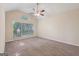 Spacious bedroom with vaulted ceiling, large windows, and neutral carpet at 686 Shore Ln, Lithonia, GA 30058