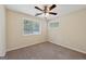 Bedroom features neutral walls, carpet and natural light from the windows at 686 Shore Ln, Lithonia, GA 30058