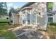 Exterior view of home featuring a patio, door, and large windows bringing in an abundance of natural light at 686 Shore Ln, Lithonia, GA 30058