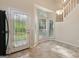 Bright kitchen nook with large windows and tiled flooring, steps to the second floor at 686 Shore Ln, Lithonia, GA 30058