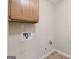 Utility room with hookups for washer and dryer and storage cabinets at 686 Shore Ln, Lithonia, GA 30058