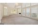 Spacious living room with high ceilings, large windows, and a cozy fireplace at 686 Shore Ln, Lithonia, GA 30058