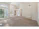 Large, open living room with a two-story ceiling, neutral carpet, and a view of the landing at 686 Shore Ln, Lithonia, GA 30058