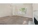 Spacious living room featuring a fireplace, neutral carpet, and lots of natural light at 686 Shore Ln, Lithonia, GA 30058