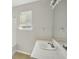 Bright bathroom featuring a window over the sink and a shower and tub combo at 4738 Golod Way, Lithonia, GA 30038