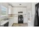 Functional kitchen with white cabinets, wood-look flooring, and modern appliances for cooking enthusiasts at 4738 Golod Way, Lithonia, GA 30038