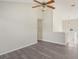 Neutral walls and modern floors define this bright living area with a view towards the entryway and staircase at 4738 Golod Way, Lithonia, GA 30038