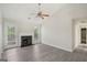 Bright living room with fireplace, vaulted ceilings, a ceiling fan, and neutral paint tones at 4738 Golod Way, Lithonia, GA 30038