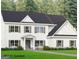 New construction home featuring a charming two-story with gray shutters and stone foundation at 115 Seymour Place, Fayetteville, GA 30214