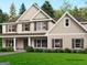 Charming two-story home with beige siding, brown shutters and lush green lawn at 170 Liberty Drive, Fayetteville, GA 30214