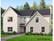 New construction two-story home with stone and siding, complemented by a well-manicured lawn at 125 Seymour Place, Fayetteville, GA 30214