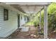 View of the back porch and leaf-covered yard at 4705 Ernest Dr, Forest Park, GA 30297