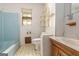 Bathroom featuring a toilet, vanity, mirror and blue bathtub at 4705 Ernest Dr, Forest Park, GA 30297