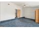 Bright bedroom featuring a ceiling fan, closet and an adjacent room at 4705 Ernest Dr, Forest Park, GA 30297