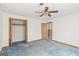 Bright bedroom featuring a ceiling fan, closet and an adjacent room at 4705 Ernest Dr, Forest Park, GA 30297