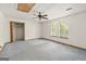 A bedroom with a ceiling fan, two windows, and a closet at 4705 Ernest Dr, Forest Park, GA 30297