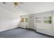 Bright room with a ceiling fan, built-in benches, carpeted flooring, and natural light at 4705 Ernest Dr, Forest Park, GA 30297